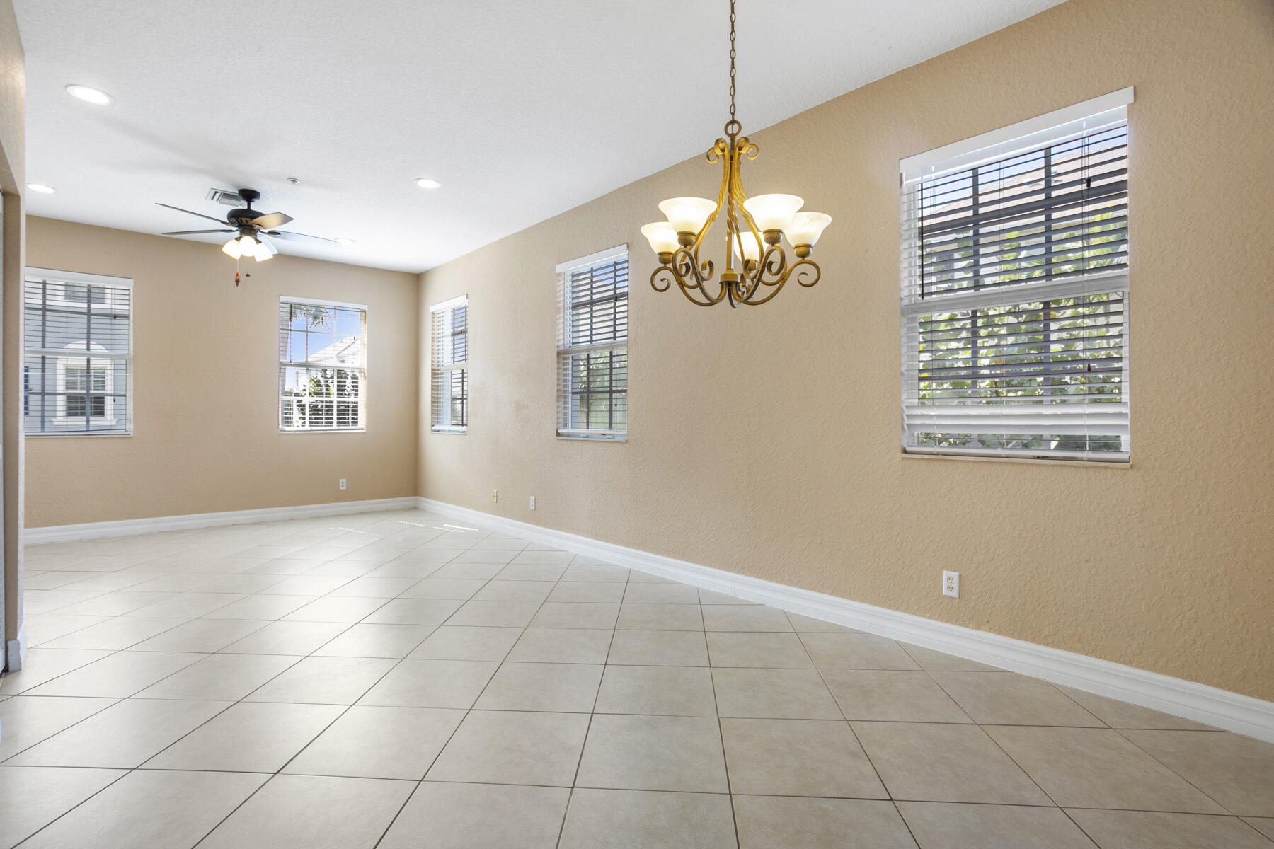 114 Locustberry Lane, Unit 101 Jupiter, FL 33458 - Photo 22 of 59 a view of an empty room with a window