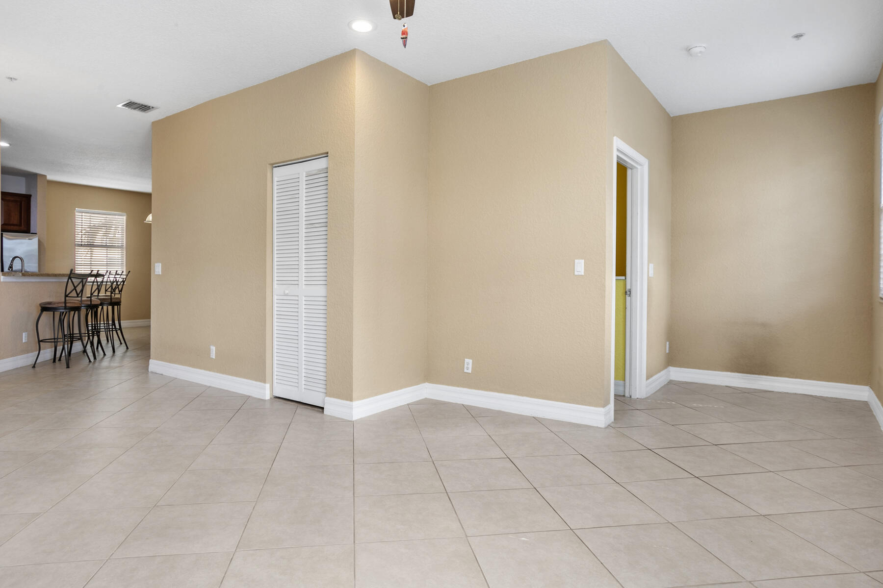 114 Locustberry Lane, Unit 101 Jupiter, FL 33458 - Photo 25 of 59 wooden floor in an empty room with a window