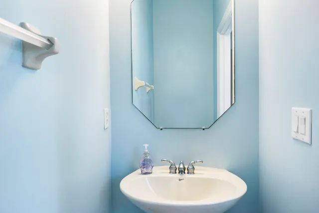 an aerial view of a house with a lake view