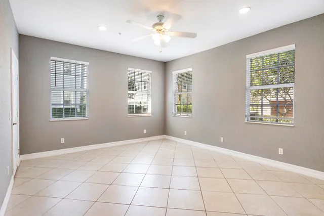 an aerial view of house with yard swimming pool and ocean view