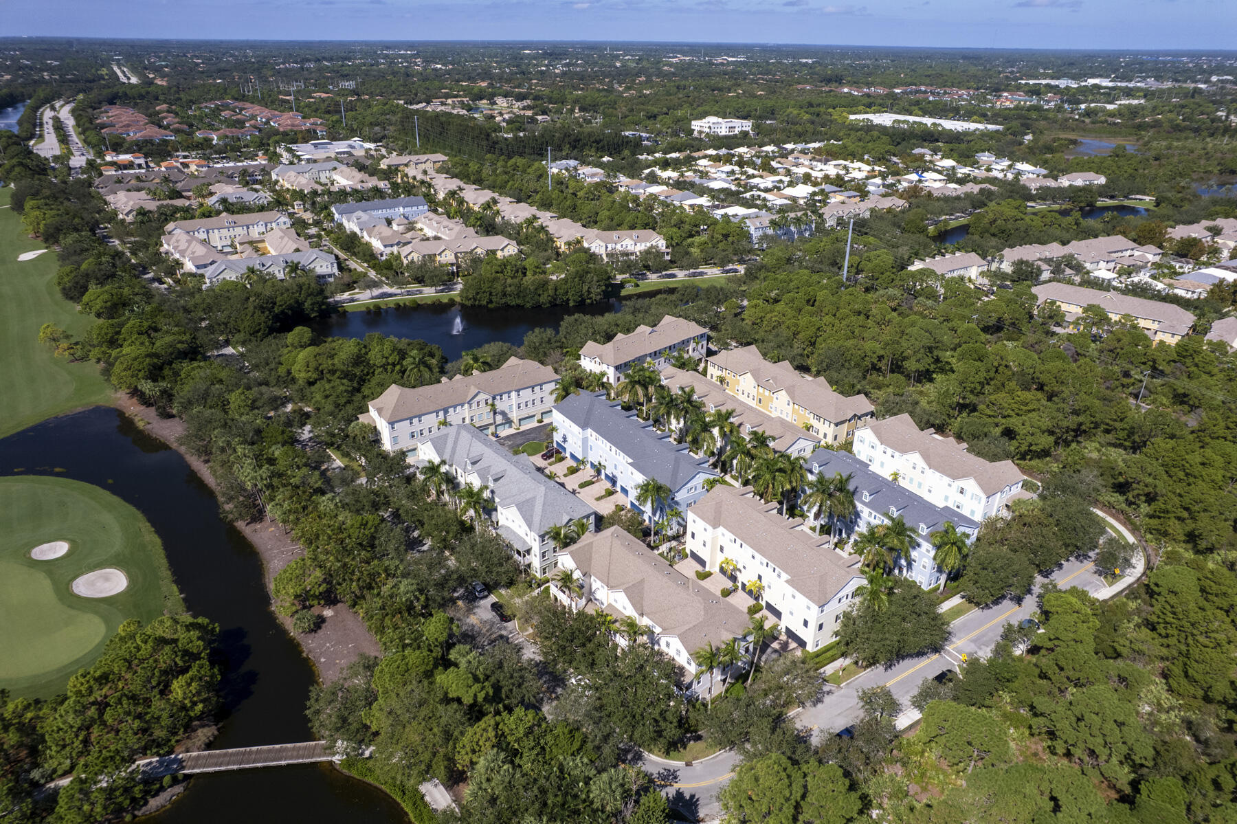 114 Locustberry Lane, Unit 101 Jupiter, FL 33458 - Photo 34 of 59 an aerial view of residential houses with outdoor space