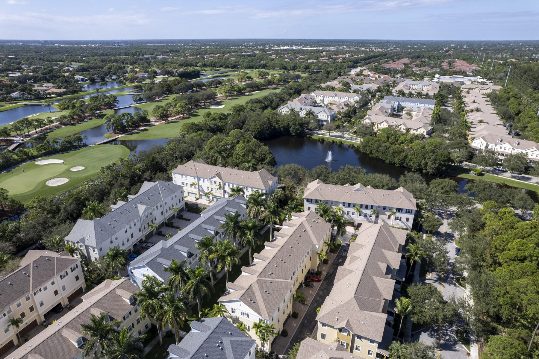 114 Locustberry Lane, Unit 101 Jupiter, FL 33458 - Photo 46 of 59 an aerial view of a house with a lake view