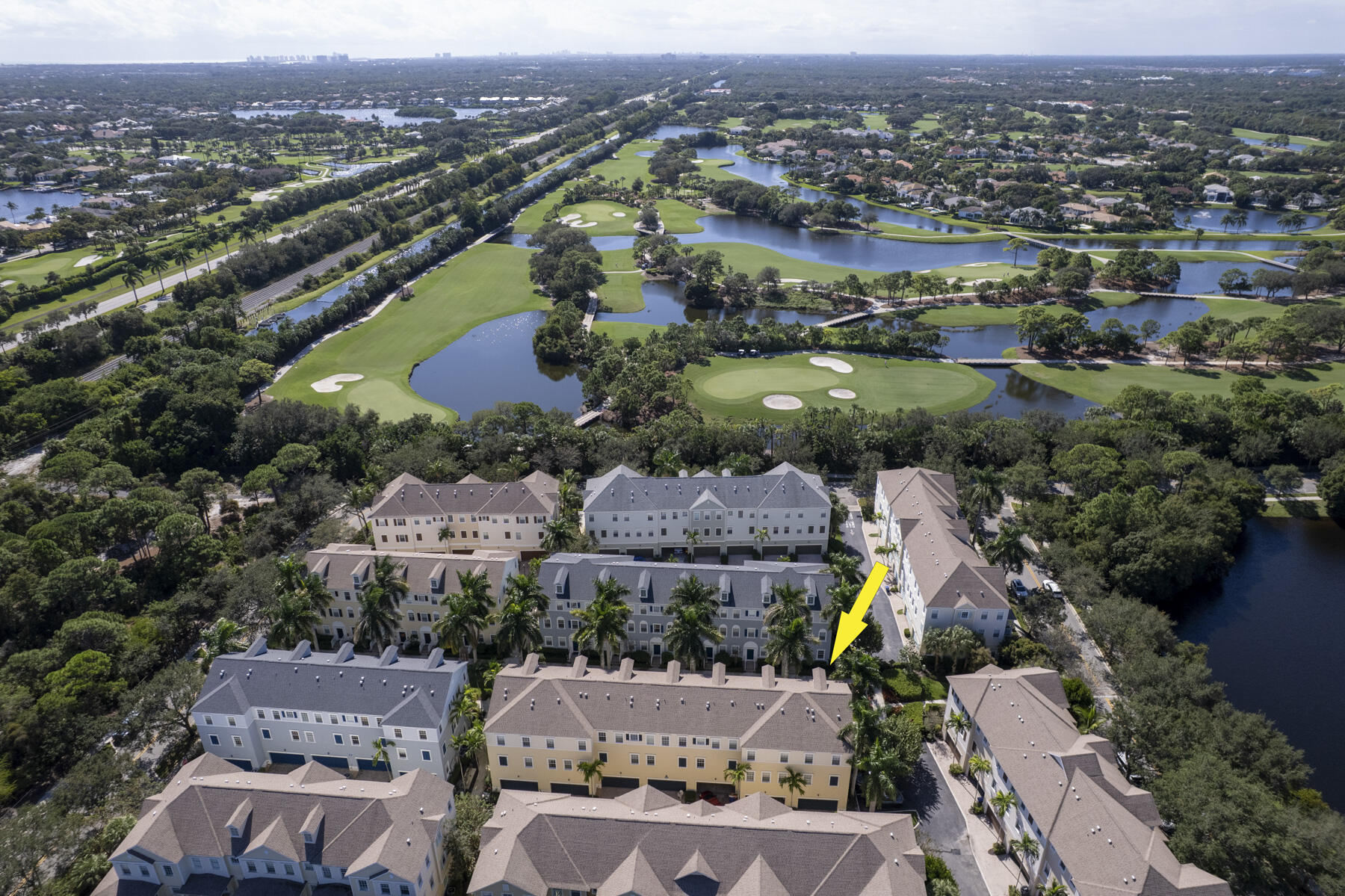 114 Locustberry Lane, Unit 101 Jupiter, FL 33458 - Photo 47 of 59 an aerial view of house with yard swimming pool and ocean view