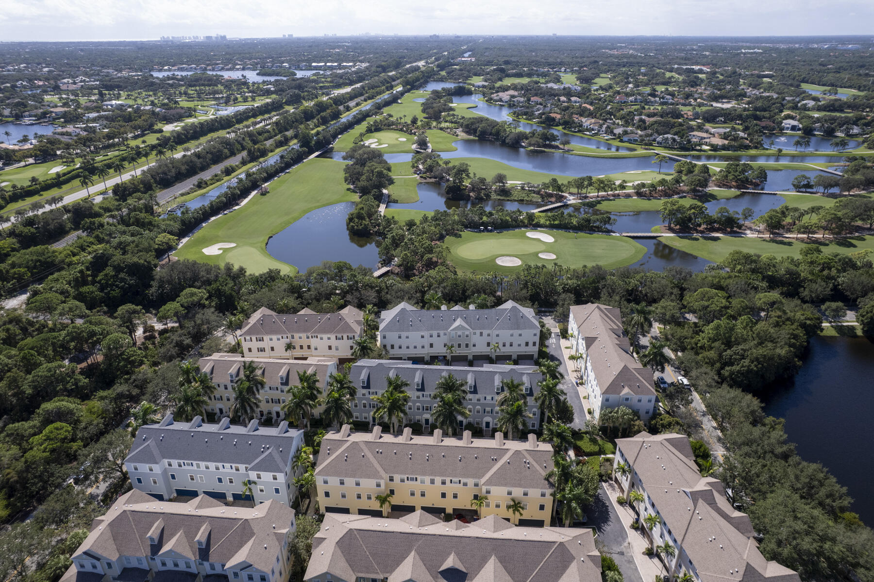 114 Locustberry Lane, Unit 101 Jupiter, FL 33458 - Photo 48 of 59 an aerial view of a city with lots of residential buildings
