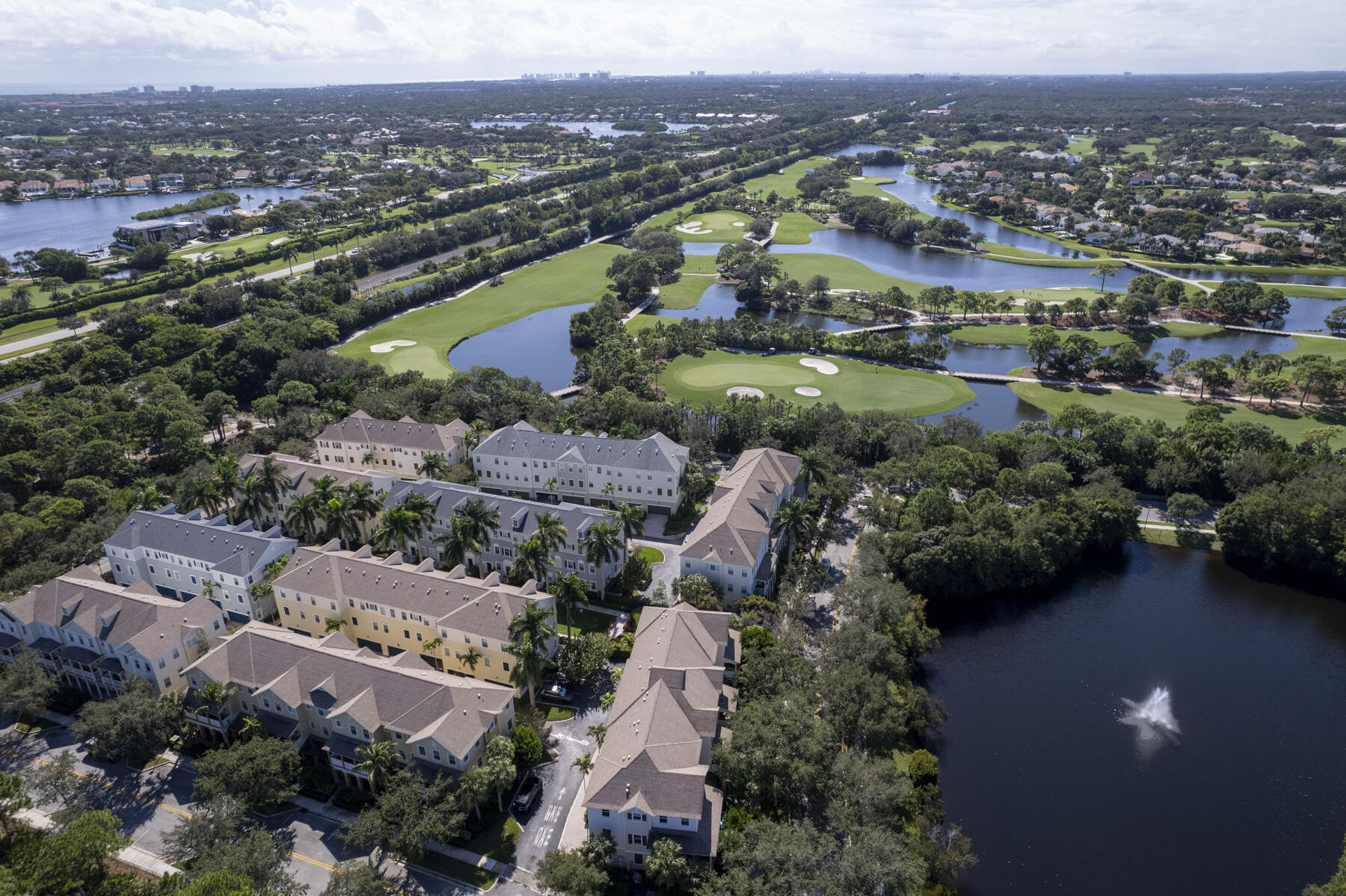 114 Locustberry Lane, Unit 101 Jupiter, FL 33458 - Photo 50 of 59 an aerial view of a city with lots of residential buildings