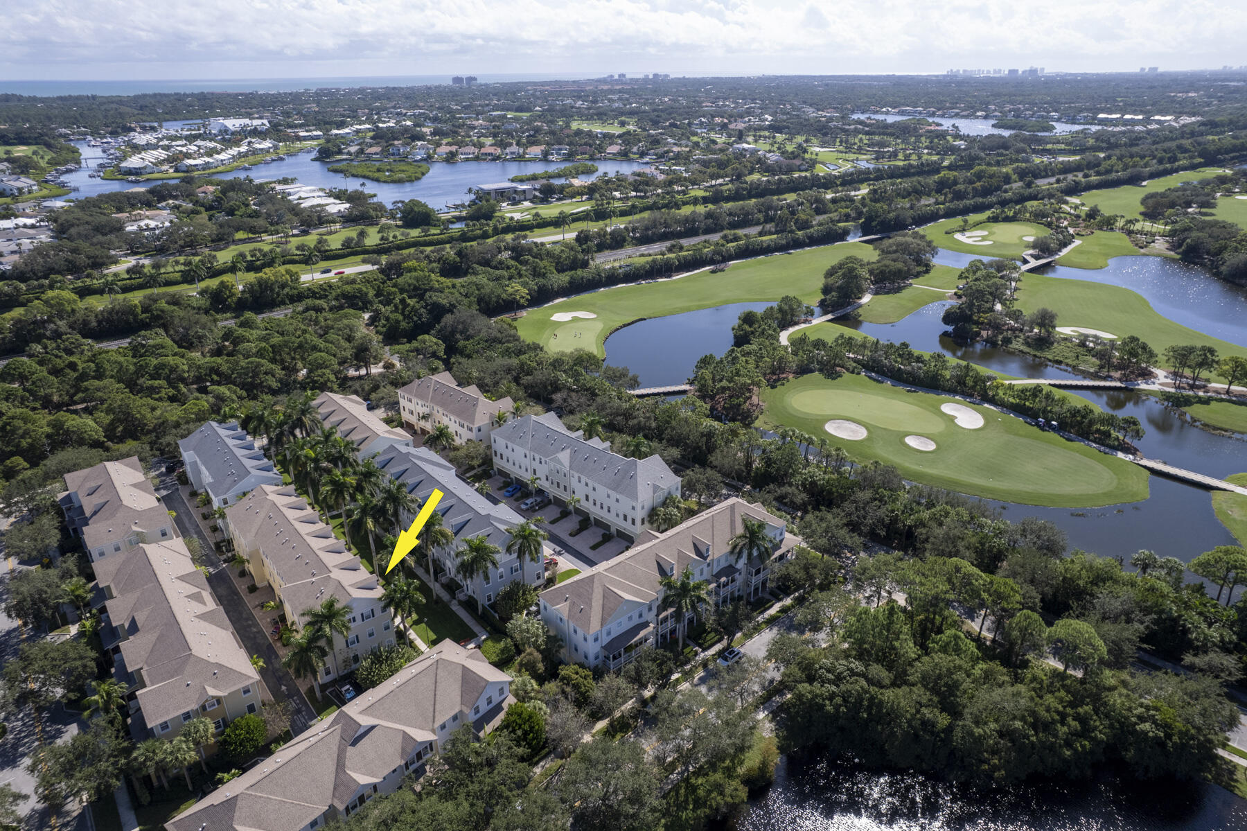 114 Locustberry Lane, Unit 101 Jupiter, FL 33458 - Photo 51 of 59 an aerial view of a city with mountains