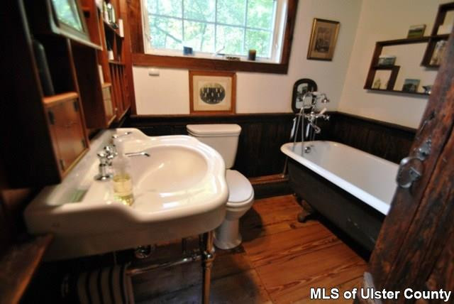 451 Scarawan Road Stone Ridge, NY 12484 - Photo 11 of 15 a bathroom with a sink a mirror and a toilet