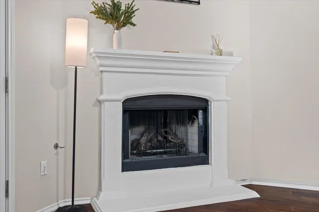 a close view of a fireplace with a hallway