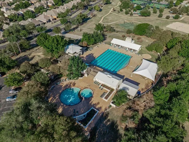 an aerial view of a house with garden space and street view