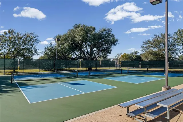 a view of an outdoor space and tennis court