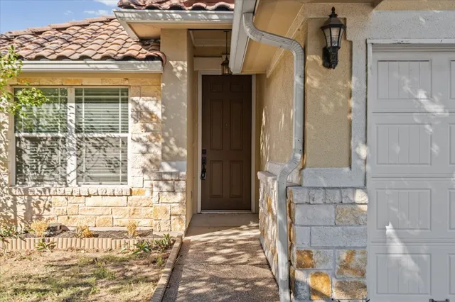 a front view of a house with a glass door