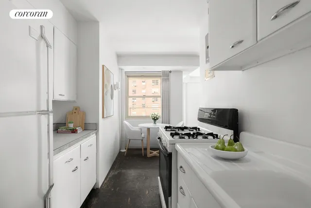 a kitchen with a sink appliances and cabinets