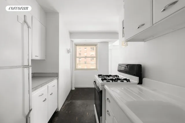 a kitchen with stainless steel appliances a sink stove and refrigerator