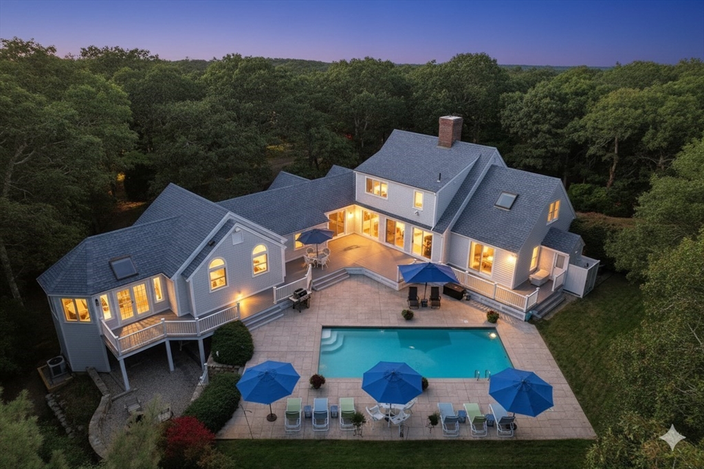 6 Heron Way Mashpee, MA 02649 - Photo 1 of 42 an aerial view of a house with a yard and a large tree