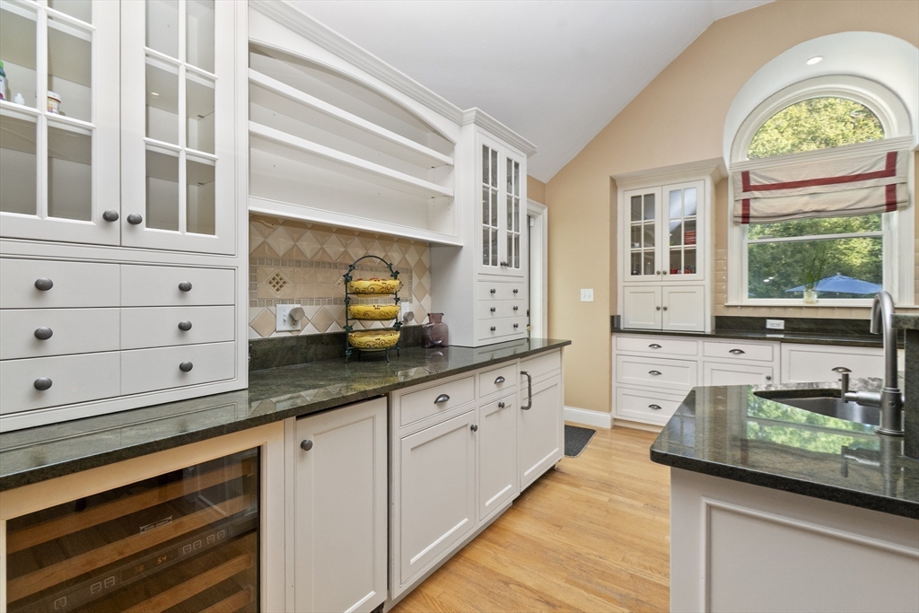 6 Heron Way Mashpee, MA 02649 - Photo 14 of 42 a kitchen with granite countertop white cabinets and a window
