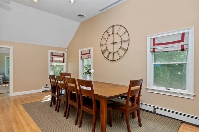 a view of a dining room with furniture window and wooden floor