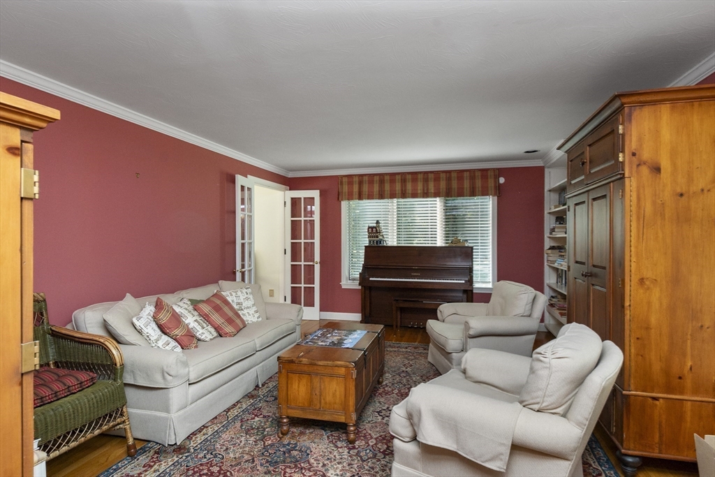 6 Heron Way Mashpee, MA 02649 - Photo 22 of 42 a living room with furniture and a flat screen tv