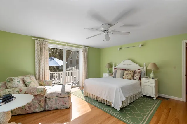 a bedroom with a bed couch and a window