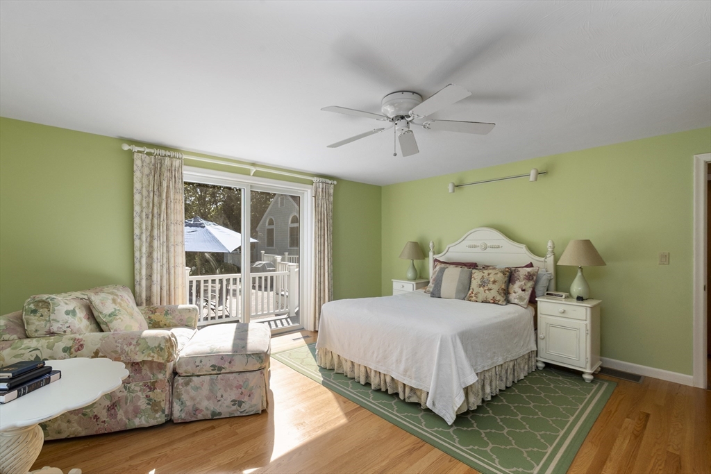 6 Heron Way Mashpee, MA 02649 - Photo 24 of 42 a bedroom with a bed couch and a window