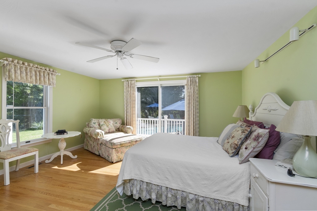 6 Heron Way Mashpee, MA 02649 - Photo 25 of 42 a bedroom with a bed and wooden floor