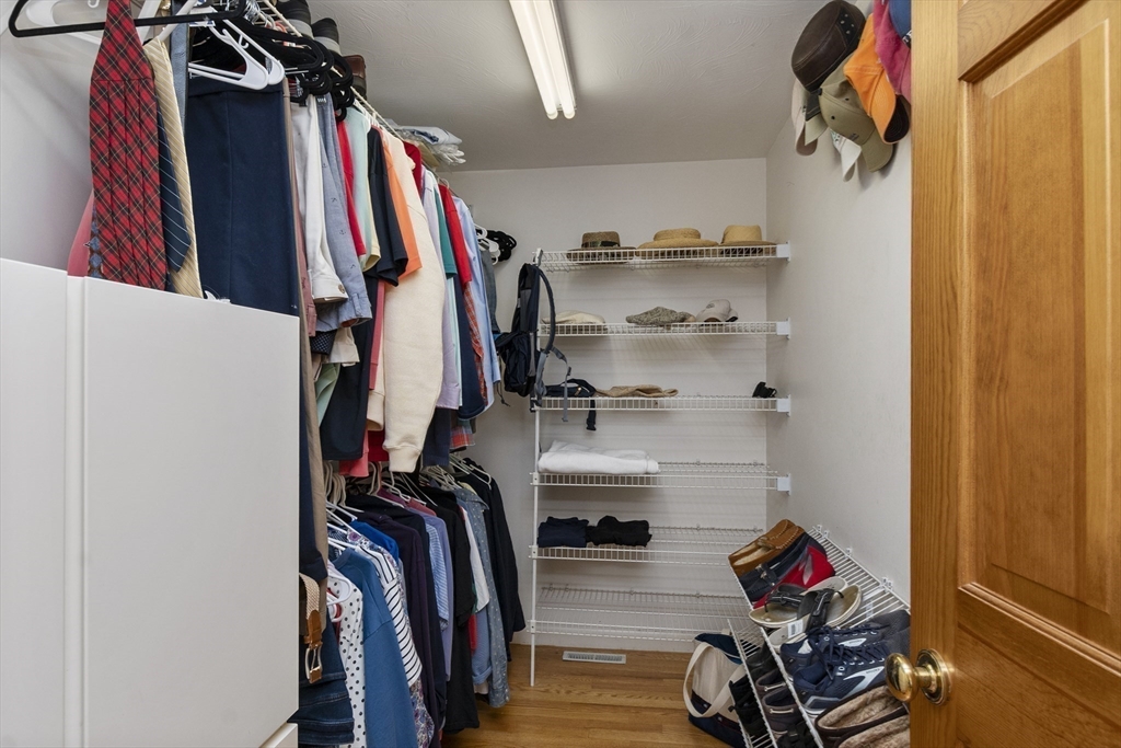 6 Heron Way Mashpee, MA 02649 - Photo 26 of 42 a view of walk in closet with clothes and shoes