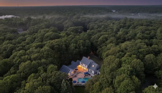 a living room with furniture and a large window with balcony view