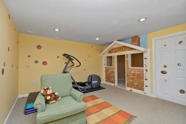 a bedroom with furniture and a chandelier