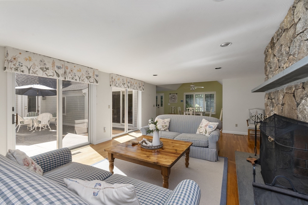 6 Heron Way Mashpee, MA 02649 - Photo 8 of 42 a living room with furniture and a fireplace