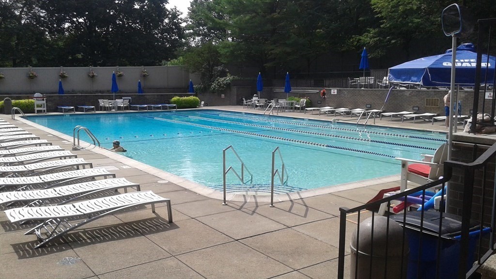 44 Washington Street, Unit 304 Brookline, MA 02445 - Photo 7 of 15 a swimming pool with outdoor seating and yard