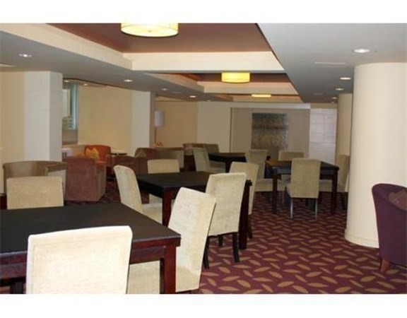 44 Washington Street, Unit 304 Brookline, MA 02445 - Photo 10 of 15 a living room with furniture and a gym machine