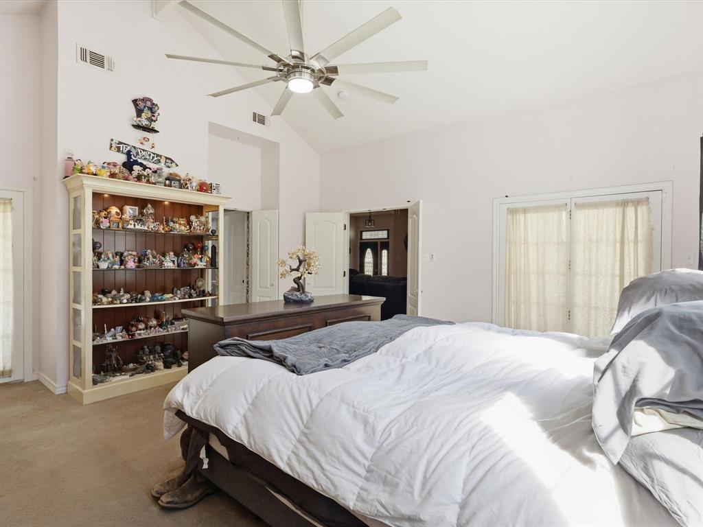 130 Parsonage Street Azle, TX 76020 - Photo 12 of 39 Bedroom featuring lofted ceiling, light colored carpet, and ceiling fan