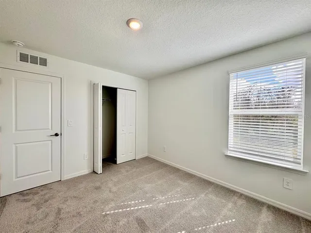a white bath tub sitting next to a white toilet