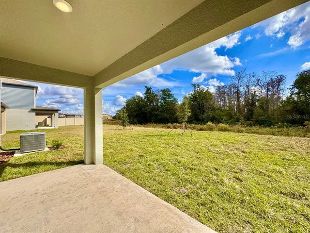 a front view of house with a garden