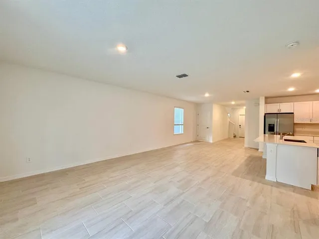a view of a kitchen with a sink and a stove top oven