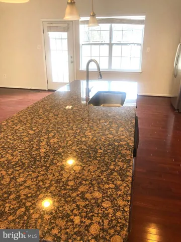 a kitchen with a sink and a window