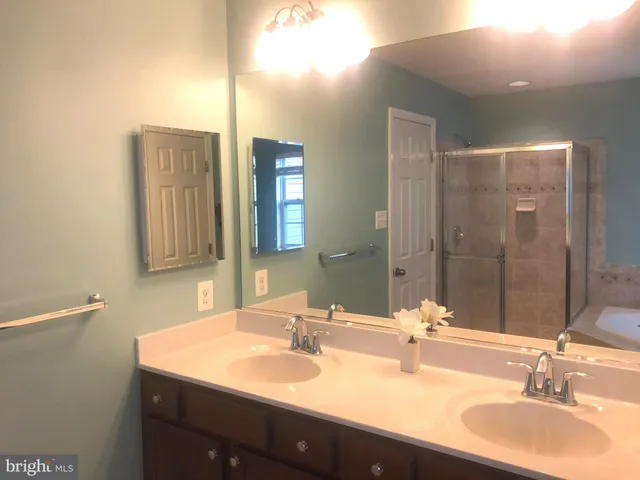 a view of a hallway with two rooms