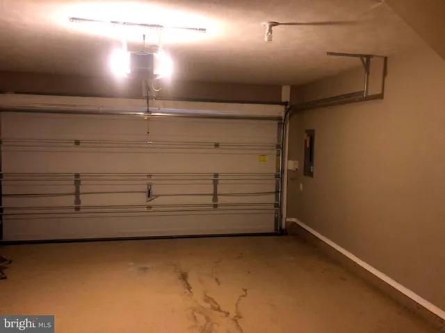 an empty room with closet and a bathroom