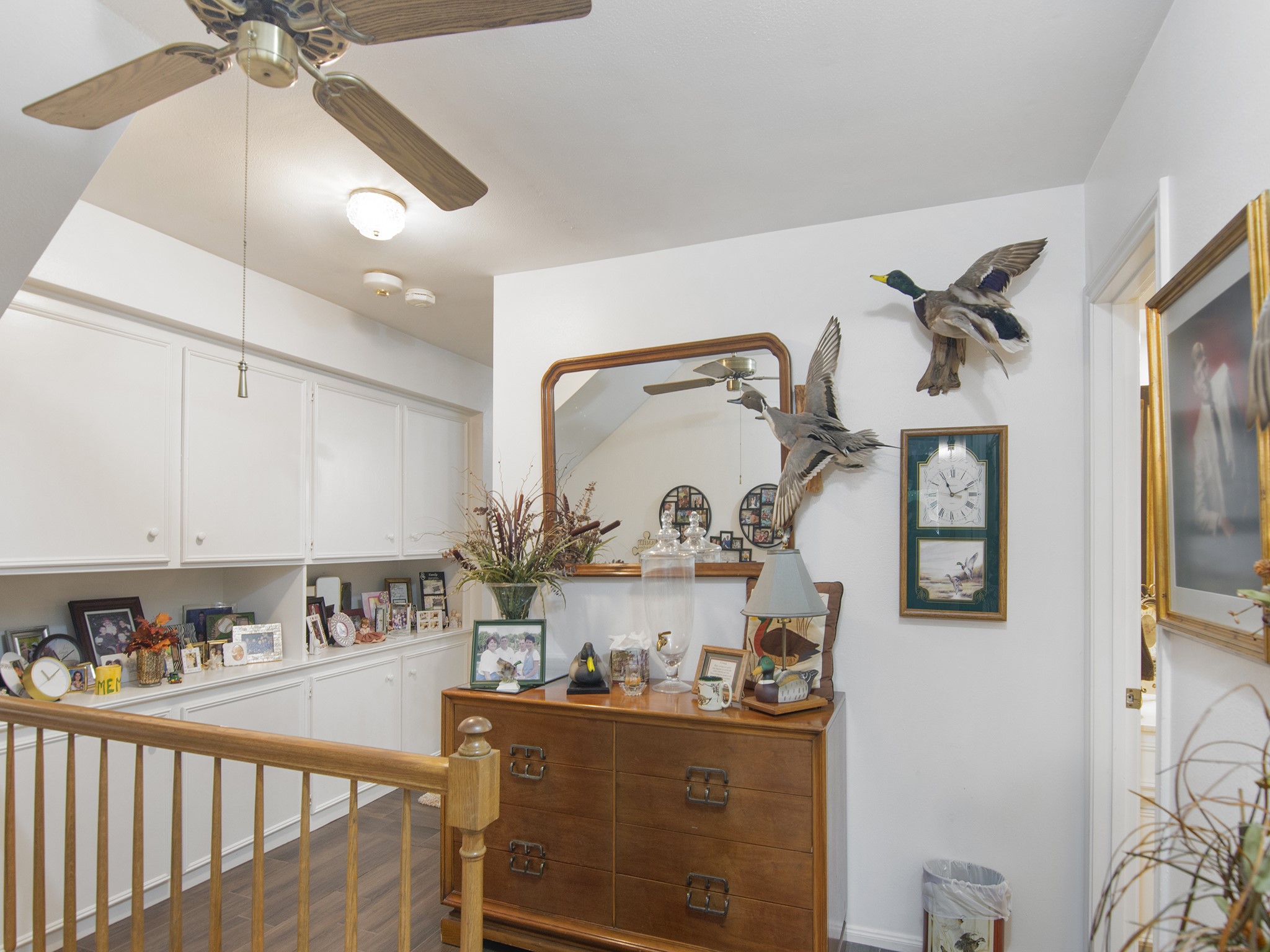 532 Raleigh Drive Conroe, TX 77302 - Photo 21 of 40 Spacious upstairs landing featuring storage cabinets and display shelf. A perfect area to personize your belongings.
