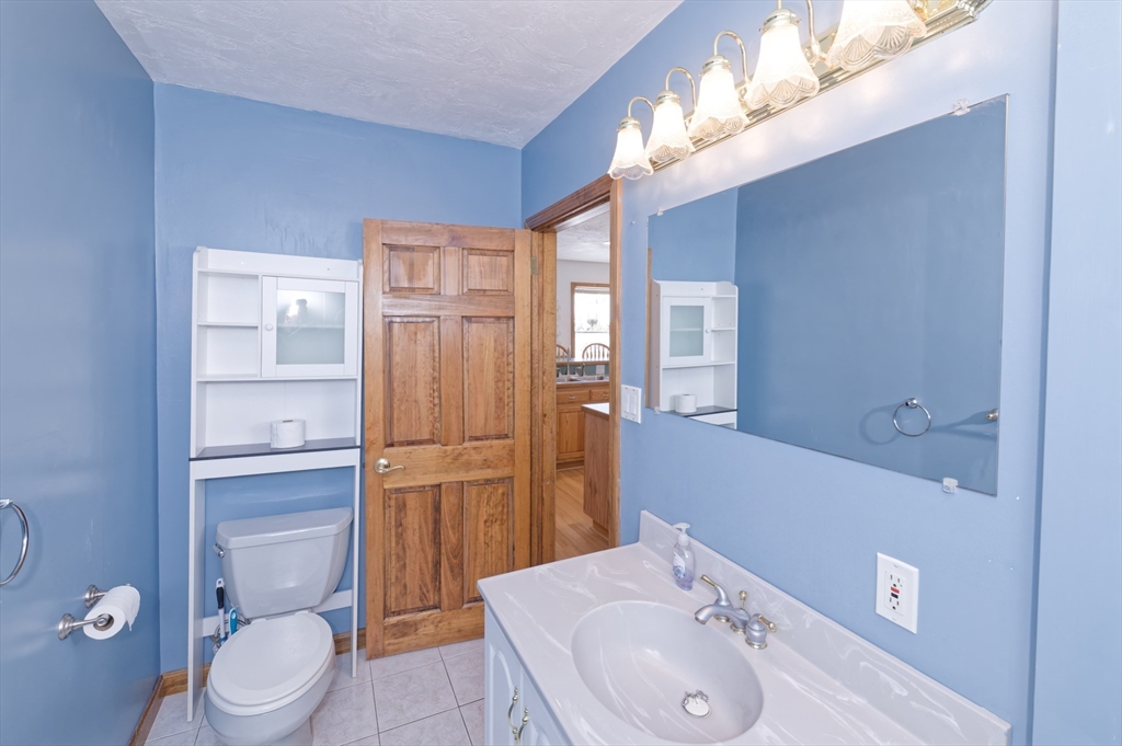 51 Brandon Road Dudley, MA 01571 - Photo 22 of 42 a bathroom with a sink a toilet and shower