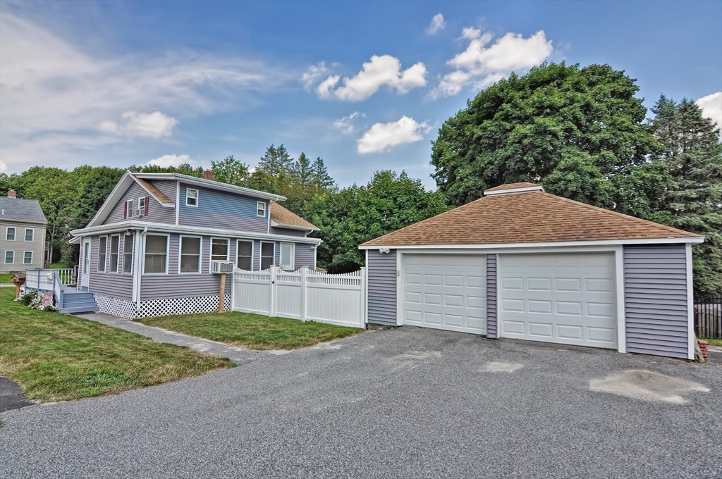 51 Brandon Road Dudley, MA 01571 - Photo 40 of 42 front view of a house with a yard