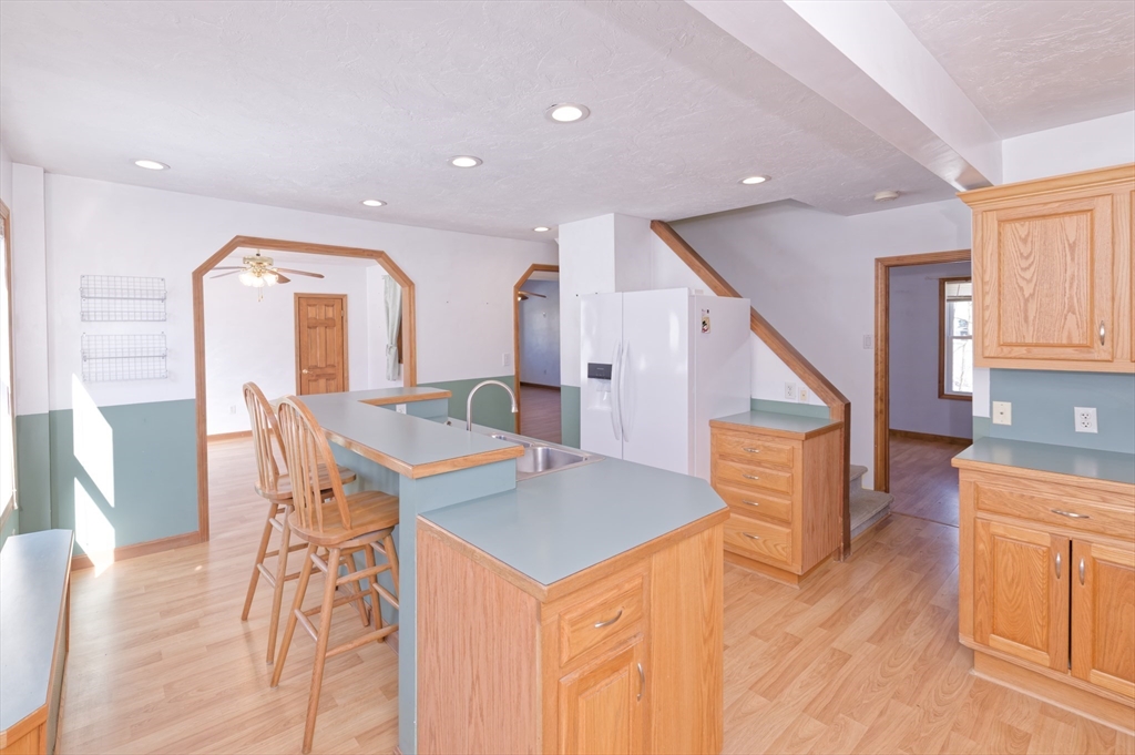 51 Brandon Road Dudley, MA 01571 - Photo 10 of 42 a view of a dining room with furniture and wooden floor