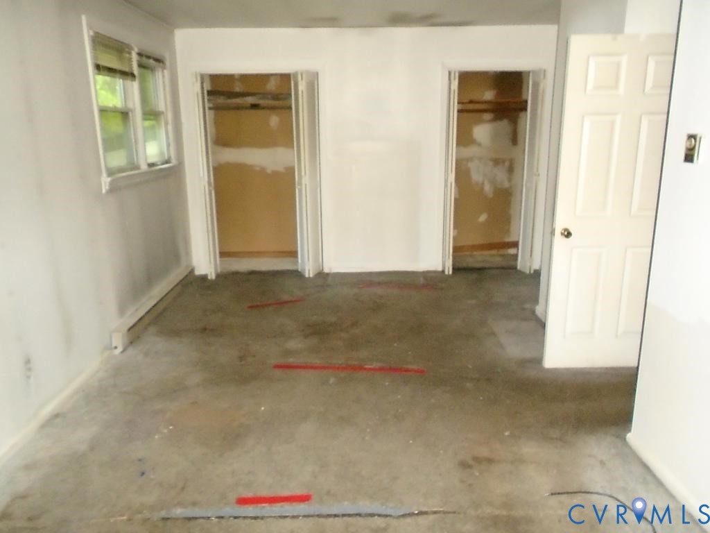 16203 West Patrick Henry Road Montpelier, VA 23192 - Photo 9 of 23 Room with light-colored walls and baseboard heatin