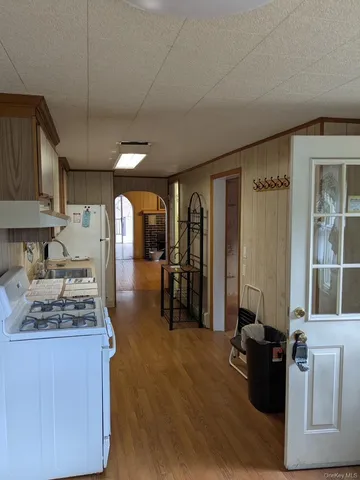 a kitchen with refrigerator and window