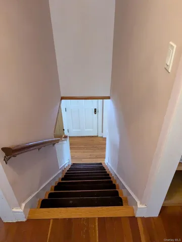 a view of entryway with wooden floor