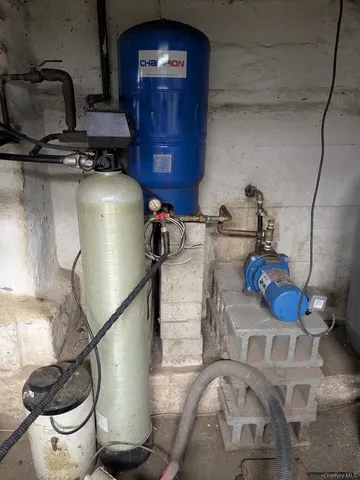 a kitchen with a stove and a wooden floor