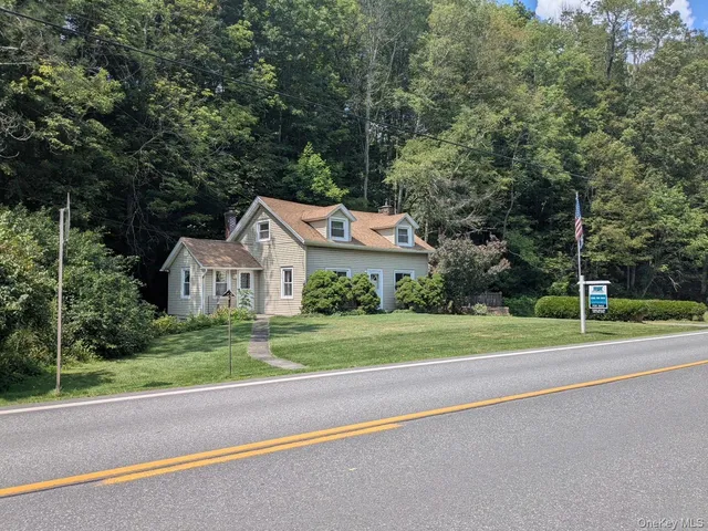 a house with a yard and a large trees