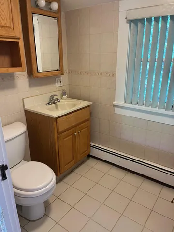 a room with table chairs and windows