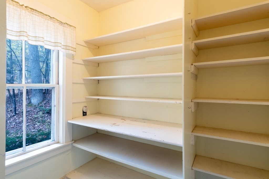 16 Hazelton Road Rowe, MA 01367 - Photo 18 of 33 a storage room with empty racks