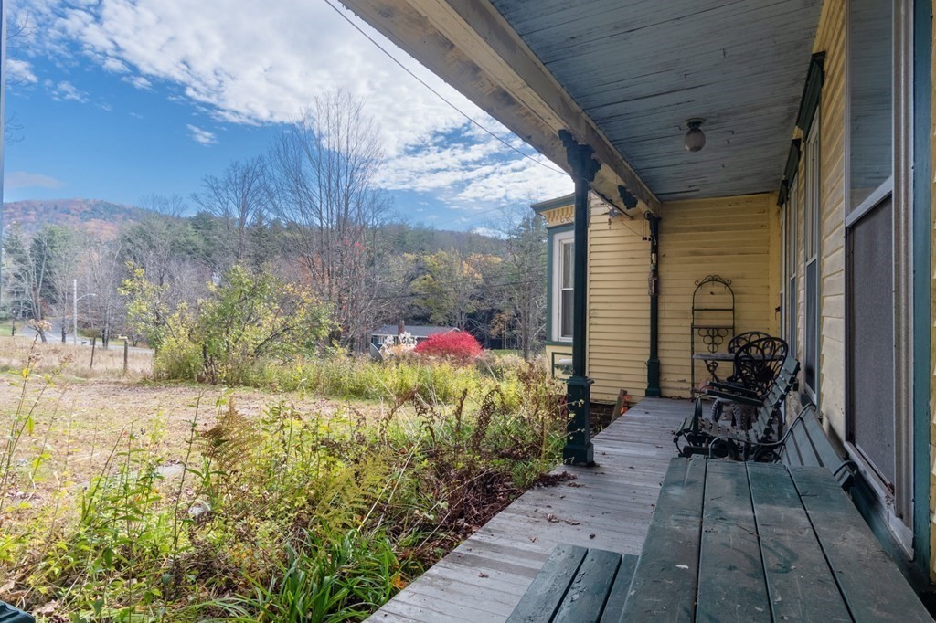 16 Hazelton Road Rowe, MA 01367 - Photo 31 of 33 a backyard of a house with yard and outdoor seating