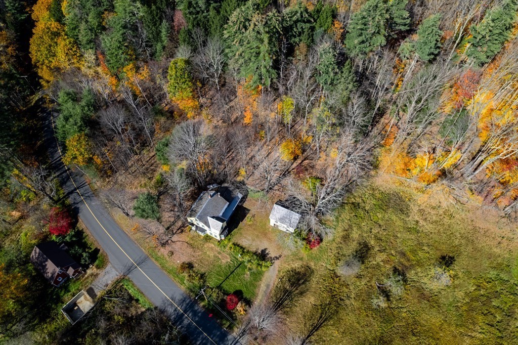 16 Hazelton Road Rowe, MA 01367 - Photo 5 of 33 a backyard of a house with lots of green space